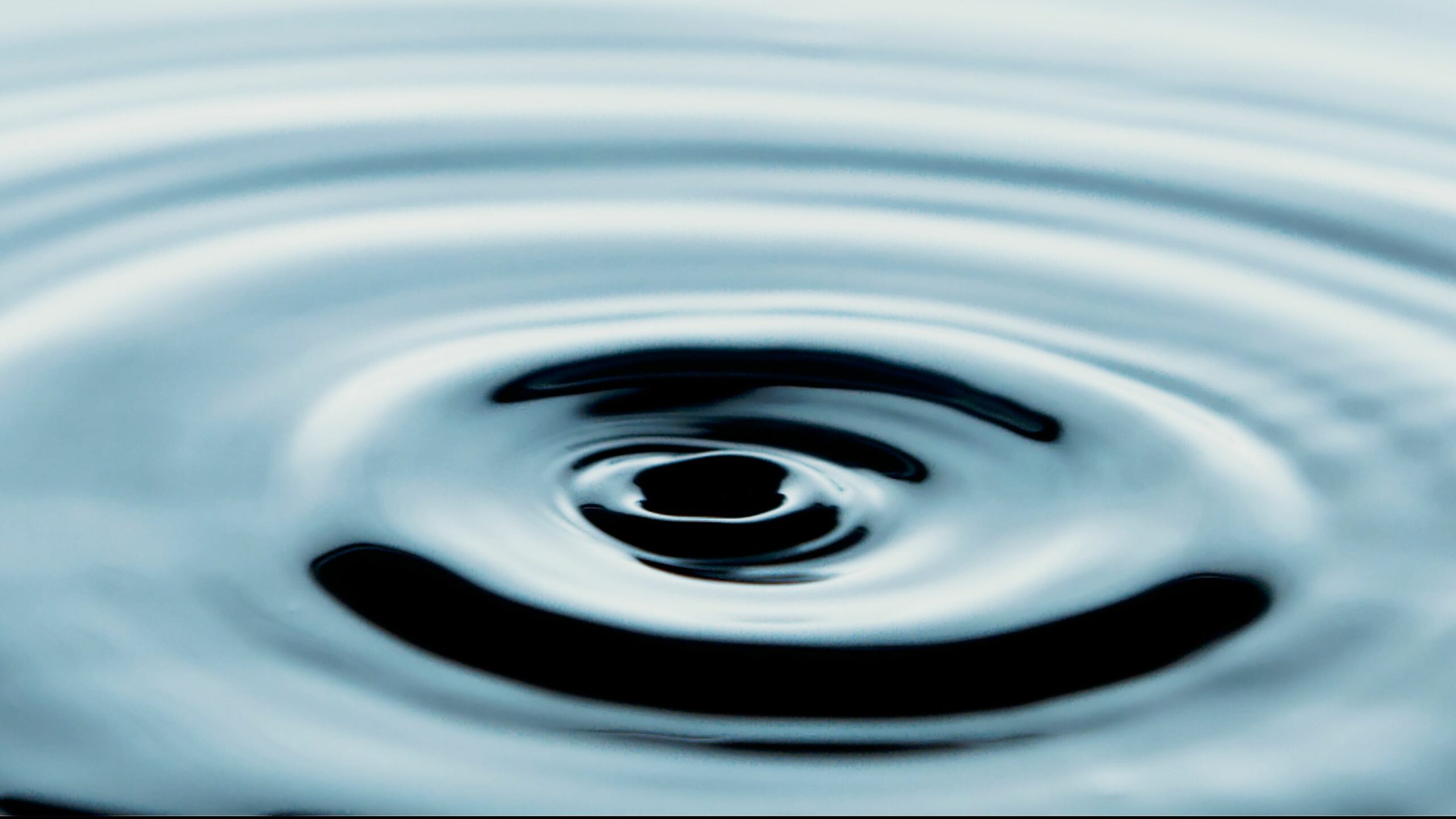 Contact Captivating water ripples in abstract blue tones, perfect for artistic backgrounds.